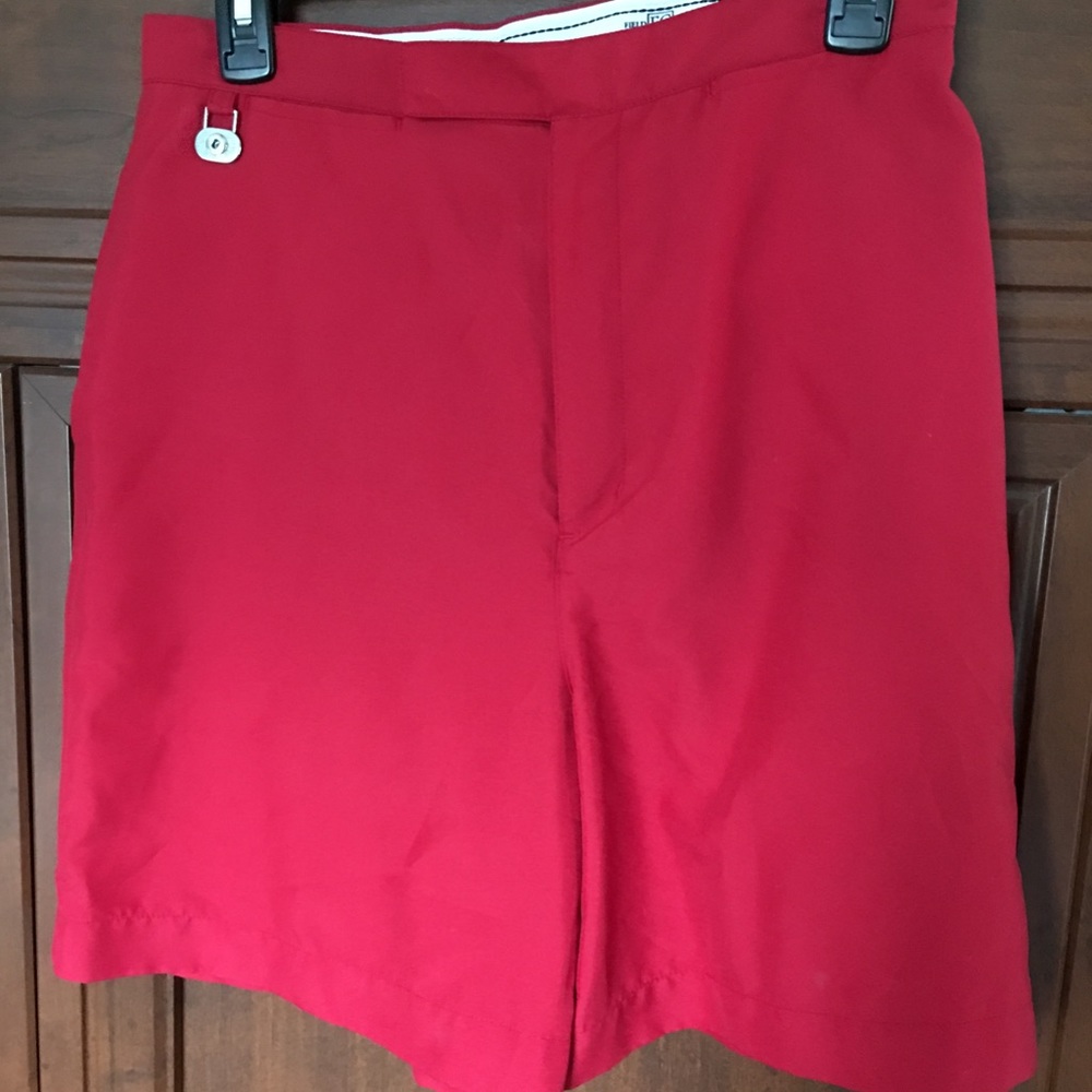Red golf shorts.